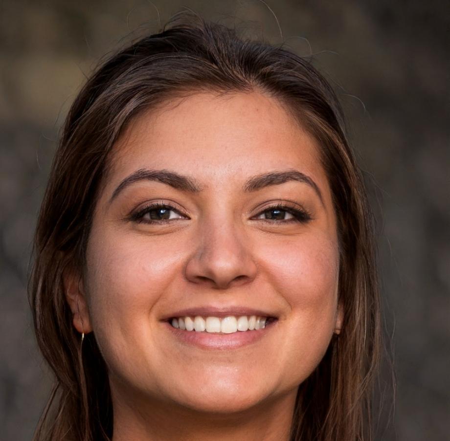 Professional headshot of Zara Okonkwo, Lead Blockchain Architect at ChargeGleam, in business attire against a modern office background